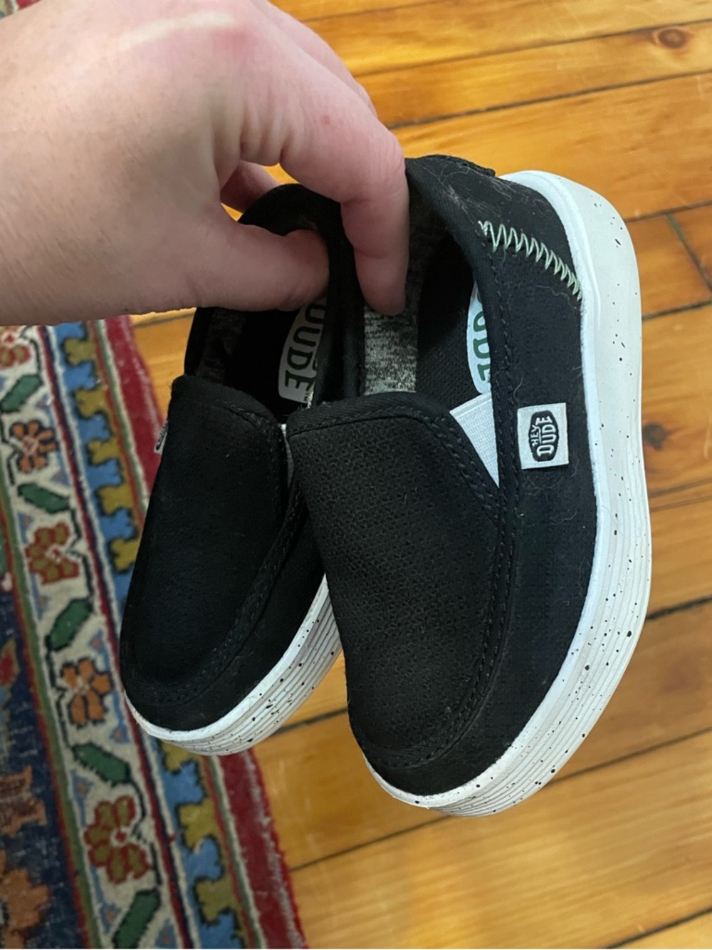 Hey Dude Black Slip-On Kids Sneakers with White Speckled Sole